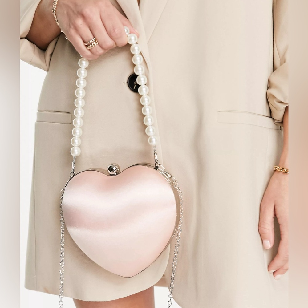 True Decadence - heart clutch bag in pink satin with faux pearl handle